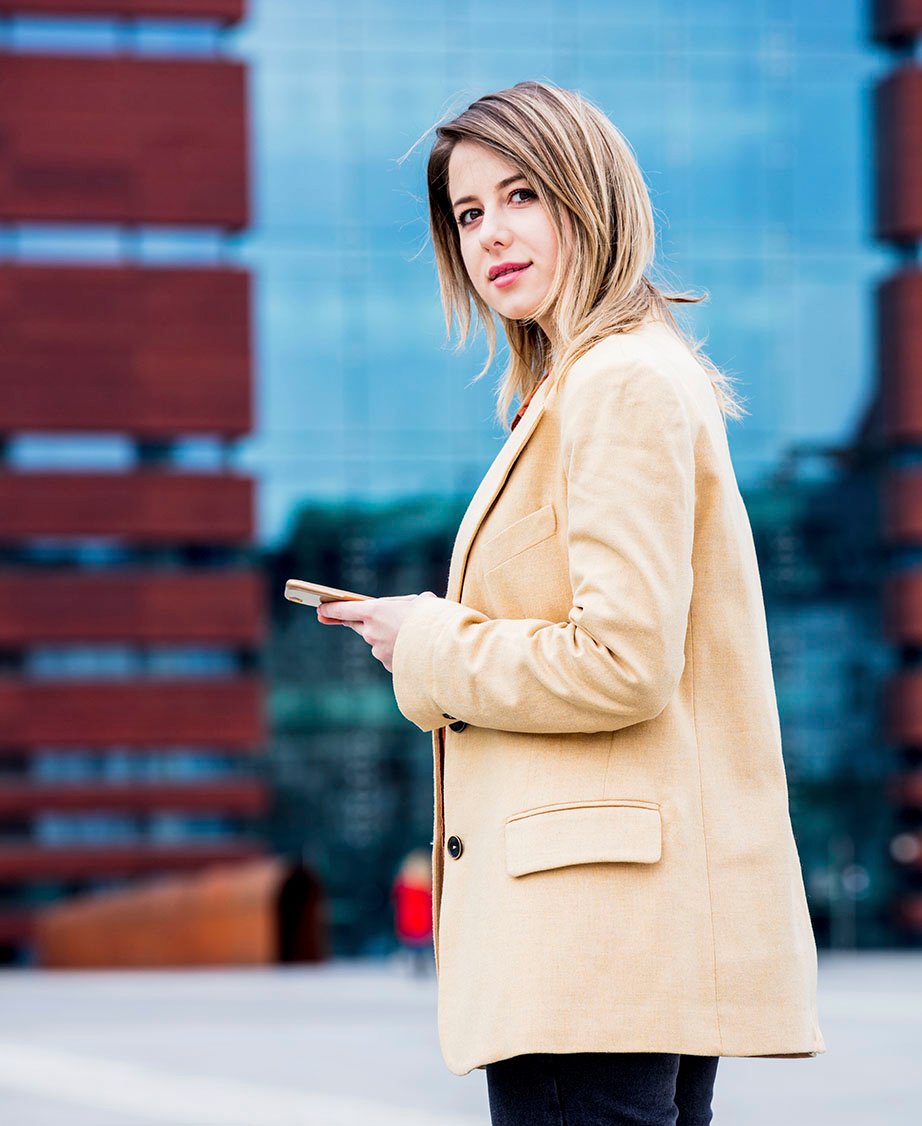 businesswoman typing message by phone on the city 2022 01 12 05 09 31 utc